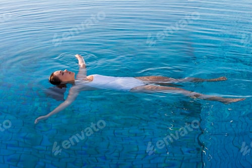 Preview: A Woman Swimming Alone At A Pool