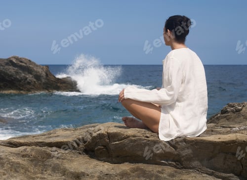 Preview: A Woman Meditating By The Sea