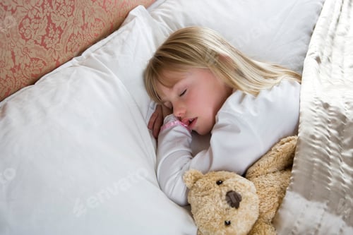 Preview: Young Girl Asleep In Her Bed With A Teddy Bear