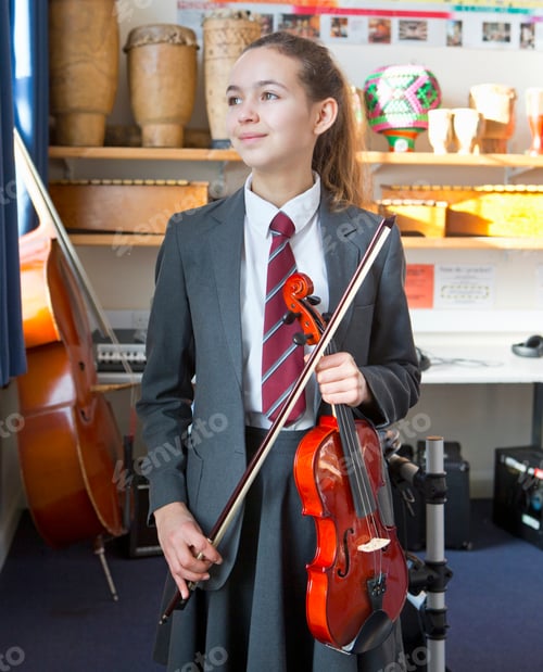 Preview: Proud High School Student With Violin In Music Classroom