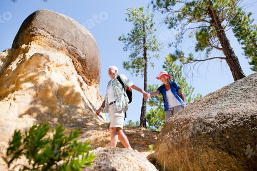 Preview: Senior Couple Holding Hands While Hiking In A Rural Area