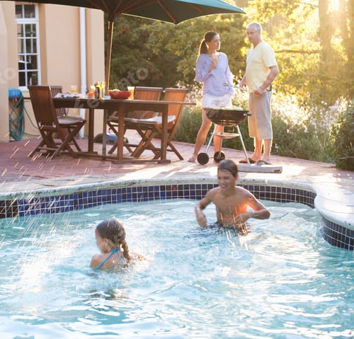 Preview: Children Swimming In The Pool At A Family Barbeque