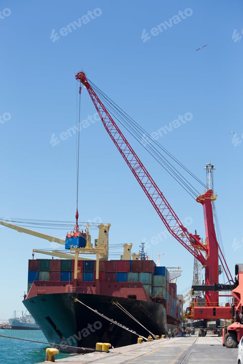 Preview: Vertical Shot Of A Port With Ships Being Unloaded Of The Cargo Using A Hauler