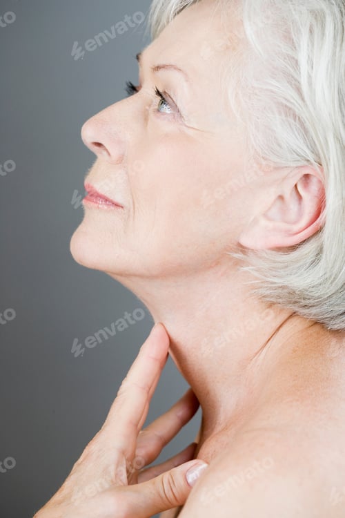 Preview: A Senior Woman Touching Her Neck