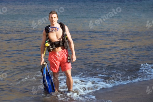 Preview: A Male Scuba Diver Returning To The Shore