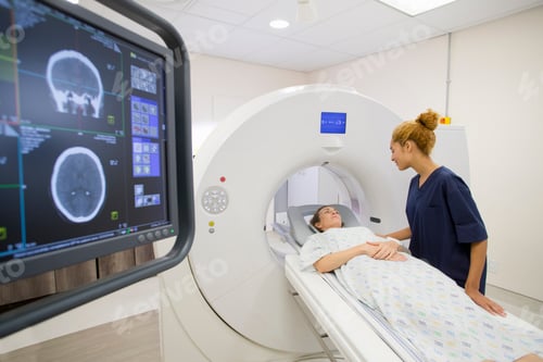 Preview: Hospital Radiographer With Female Patient Operating Ct Scanner