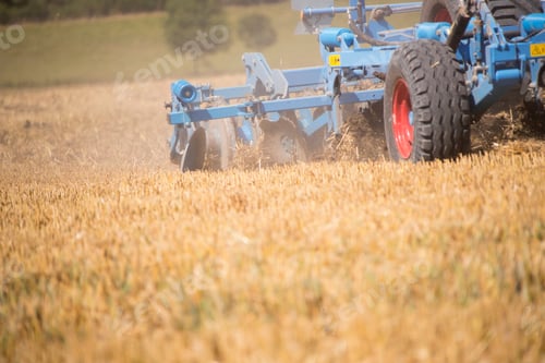 Preview: Close Up Of Tractor Ploughing Field Using Disc Plough