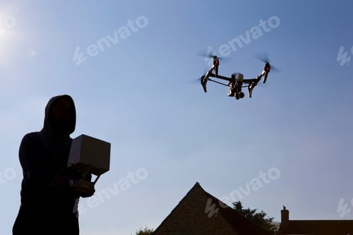 Preview: Man Operating A Surveillance Drone In The Blue Sky