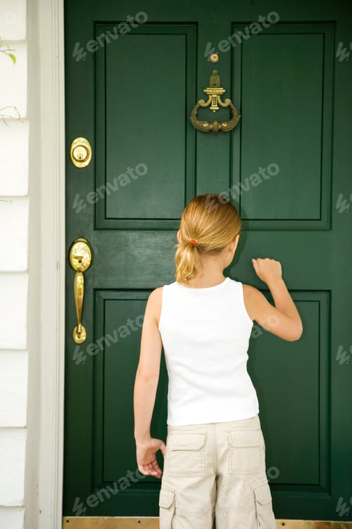 Preview: Little Girl Knocking At The Front Door Of A House