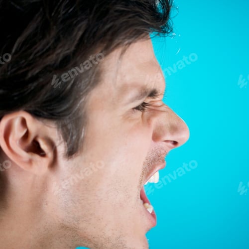 Preview: A Young Man Shouting On Blue Background