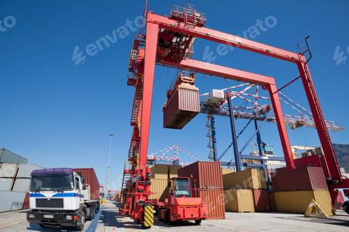 Preview: Wide Shot Of Cargo Containers Being Loaded On Lorries Using Gantry Cranes