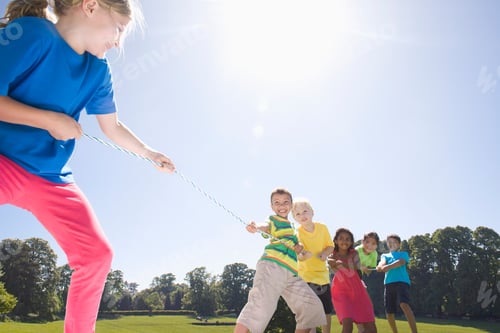 Preview: Group Of Children Playing Tug Of War In A Park