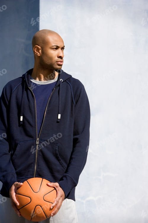 Preview: Portrait Of Young African American Man Holding A Basketball