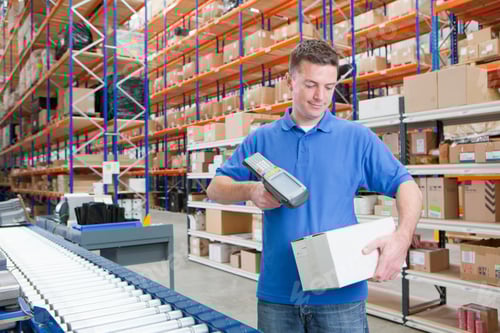 Preview: Medium Shot Of A Worker Scanning A Box At The Production Line Of A Distribution Warehouse.