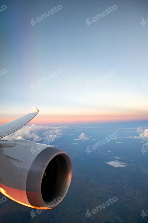 Preview: Aircraft Turbo Prop Jet Engine And Wingtip In Flight With Sunset Sky