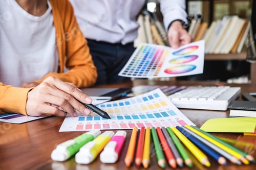 Preview: Two Colleague Creative Graphic Designer Working On Color Selection And Color Swatches, Drawing On