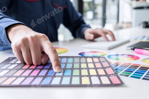 Preview: Male Creative Graphic Designer Working On Color Selection And Color Swatches, Drawing On Graphics