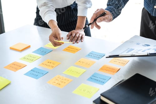 Preview: Two Creative Business People Meeting And Planning Use Note On Desk To Share Idea, Analysis Data