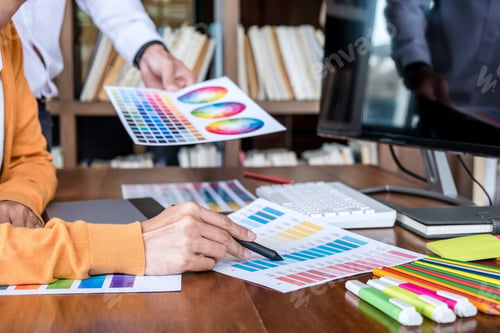 Preview: Two Colleague Creative Graphic Designer Working On Color Selection And Color Swatches, Drawing On