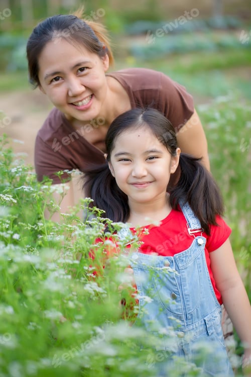 Preview: Happy Asian Daughter Gardening With Her Mother