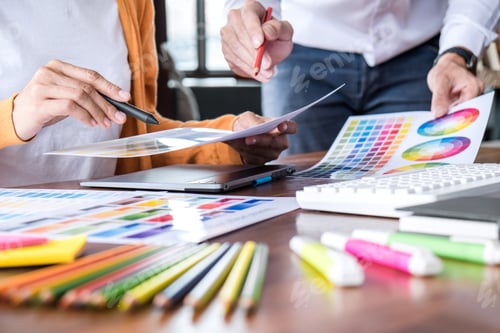 Preview: Two Colleagues Creative Graphic Designer Working On Color Selection And Drawing On Graphics Tablet