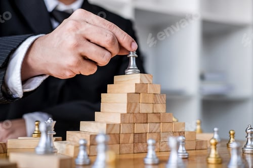Preview: Wooden Game Of Strategy, Hands Of Confident Businessman Playing Chess Game To Development Analysis