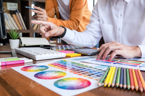 Preview: Two Colleague Creative Graphic Designer Working On Color Selection And Color Swatches, Drawing On