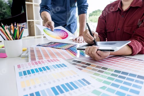 Preview: Two Colleague Creative Graphic Designer Working On Color Selection And Color Swatches, Drawing On