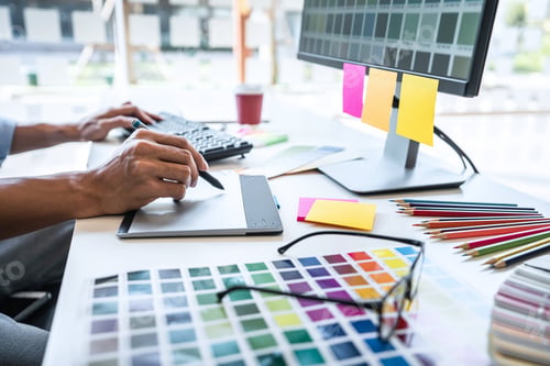 Preview: Image Of Male Creative Graphic Designer Working On Color Selection And Drawing On Graphics Tablet