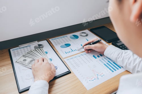 Preview: Business Analysis with Financial Charts and Hundred Dollar Bills