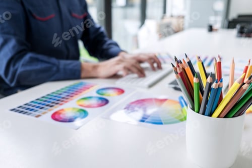 Preview: Image Of Male Creative Graphic Designer Working On Color Selection And Drawing On Graphics Tablet