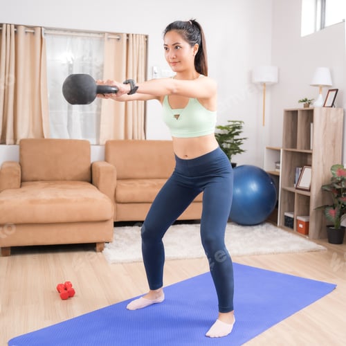 Preview: Asian Woman Exercising At Home Using Pendulum Squats