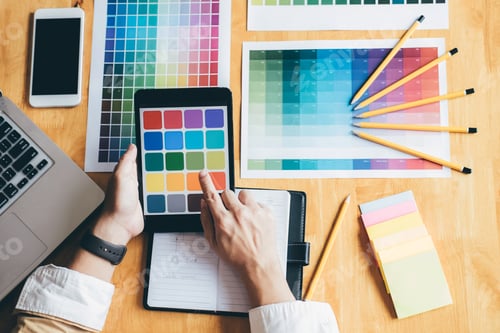Preview: Young Creative Graphic Designer Using Graphics Tablet To Choosing Color Swatch Samples Chart For
