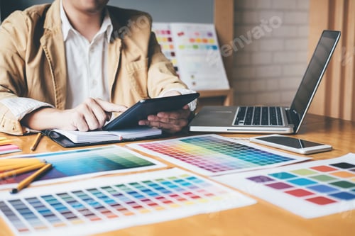 Preview: Creative Graphic Designer Using Graphics Tablet To Choosing Color Swatch Samples Chart For