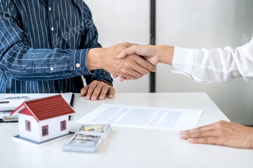 Preview: Real Estate Agent And Customers Shaking Hands Together Celebrating Finished Contract After Signing