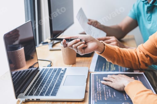 Preview: Two Professional Programmer Cooperating And Working On Web Site Project In A Software Developing On