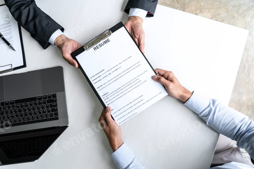 Preview: Senior Committee Manager Reading A Resume During A Job Interview, Employer Interviewing To Ask