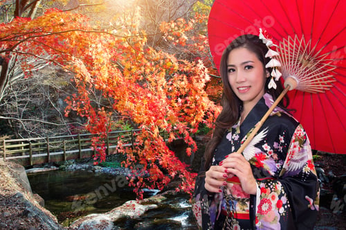 Preview: Asian Woman Wearing Traditional Japanese Kimono With Red Umbrella In Autumn.