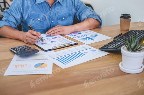 Preview: Financial Analysis: Adult at Desk Analyzing Data