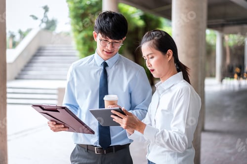 Preview: Young Business Woman Holding Tablet And Looking To This Presentation Investment To Young Business