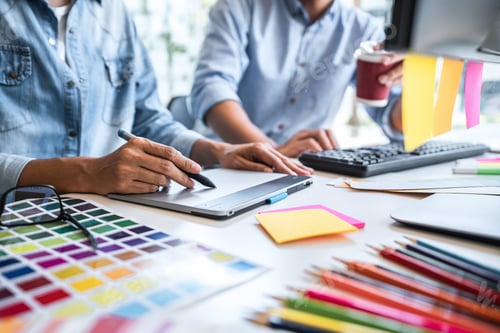 Preview: Young Colleagues Designers Working Together On A Creative Project And Color Samples For Selection