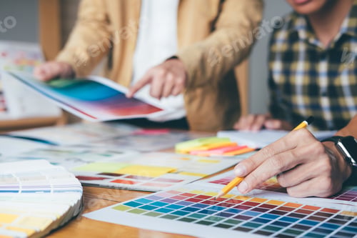 Preview: Young Creative Team Having A Meeting In Creative Office, Architectural Drawing With Work Tools And