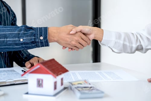 Preview: Real Estate Agent And Customers Shaking Hands Together Celebrating Finished Contract After Signing