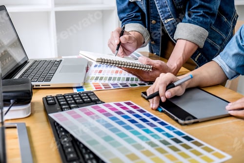 Preview: Young Creative Team Having A Meeting In Creative Office, Architectural Drawing With Work Tools And