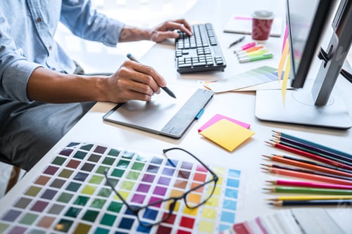 Preview: Image Of Male Creative Graphic Designer Working On Color Selection And Drawing On Graphics Tablet
