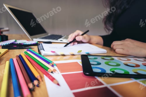Preview: Young Woman Dressmaker Or Designer Working As Fashion Designers And Drawing Sketches For Clothes