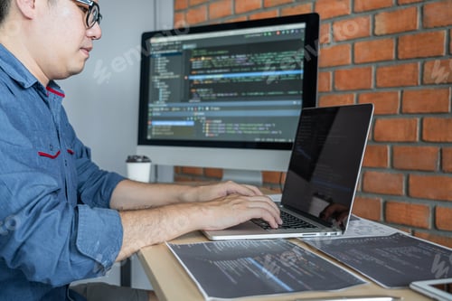Preview: Young Professional Programmer Working At Developing Programming And Website Working In A Software