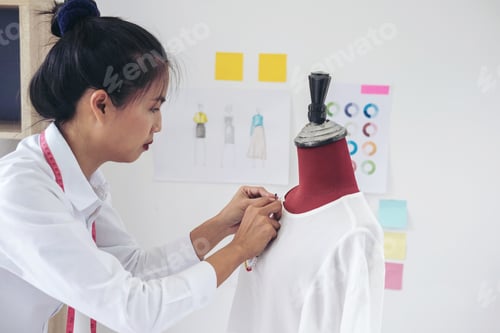 Preview: Young Woman Dressmaker Or Designer Working As Fashion Designers Measure And Repairing Clothes And