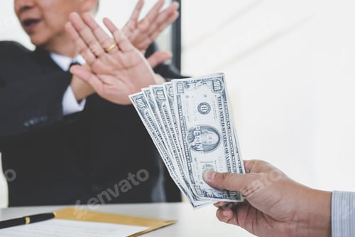 Preview: Bribery And Corruption Concept, Businessman Refusing Receive Money In The Envelope To Agreement