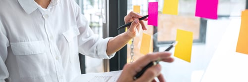 Preview: Young Creative Team Professional Using Post It Notes In Glass Wall To Writing Strategy Business